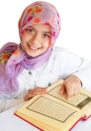 A teenage girl happily memorizing the Quran, showcasing her dedication and love for the holy book.