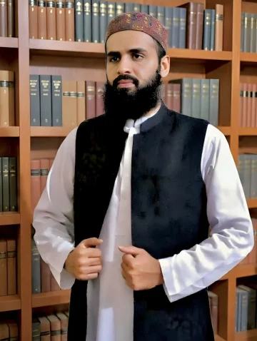 Qualified and experienced Quran tutor wearing traditional cap and waistcoat in library background